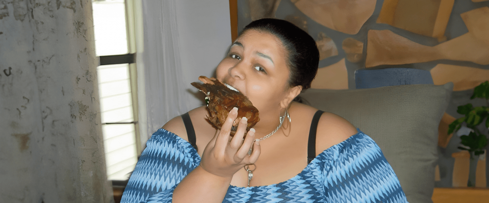 Mikki Jack eating a pork chop. - ThatDamnScale.com